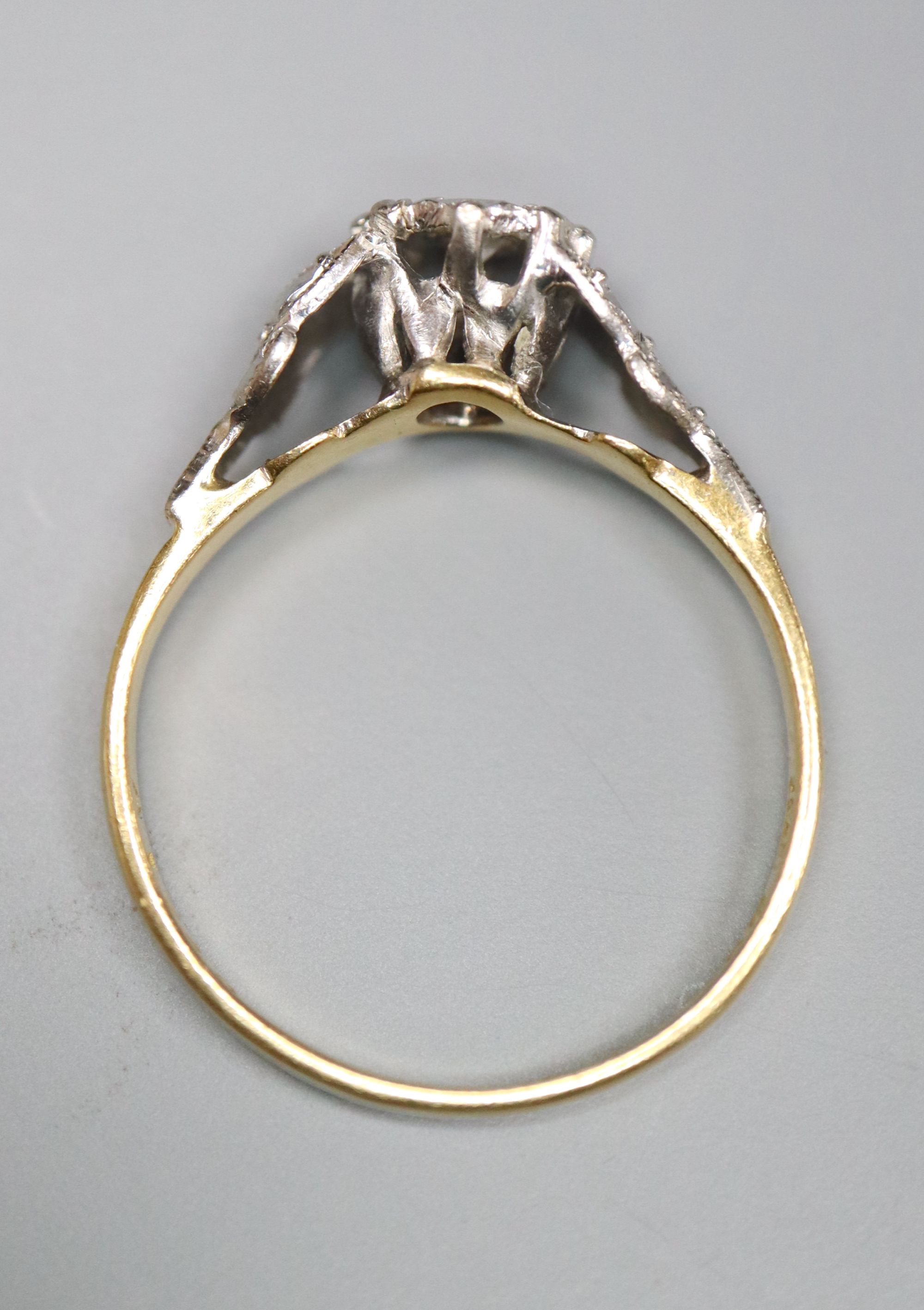 A 1960s 18ct gold and plat, illusion set solitaire diamond ring, size L, gross 2.3 grams.